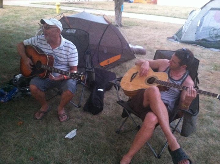 Steve Smartt of Nashville, left, and his son, Stuart Smartt of Atlanta serenaded other members of the Morrison Group in Webster City when RAGBRAI stopped there in 2012 with "Give Me One More Sip of That Worry Be Gone."