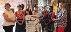In 2013,  Elly’s Tea & Coffee was named as a Blue Zones Restaurant. Pictured are, from left: Diana Broderson, Julie Edmonds, Jackie Scroggins, Molly McGuire, Shea Everhart, Angela Collins, Elly Lloyd, Jane Daufeldt. The Blue Zones Restaurant Pledge was created to help restaurants do simple things to help their guests make healthier choices and eat fewer calories, without cutting into the bottom line. Muscatine Journal photo